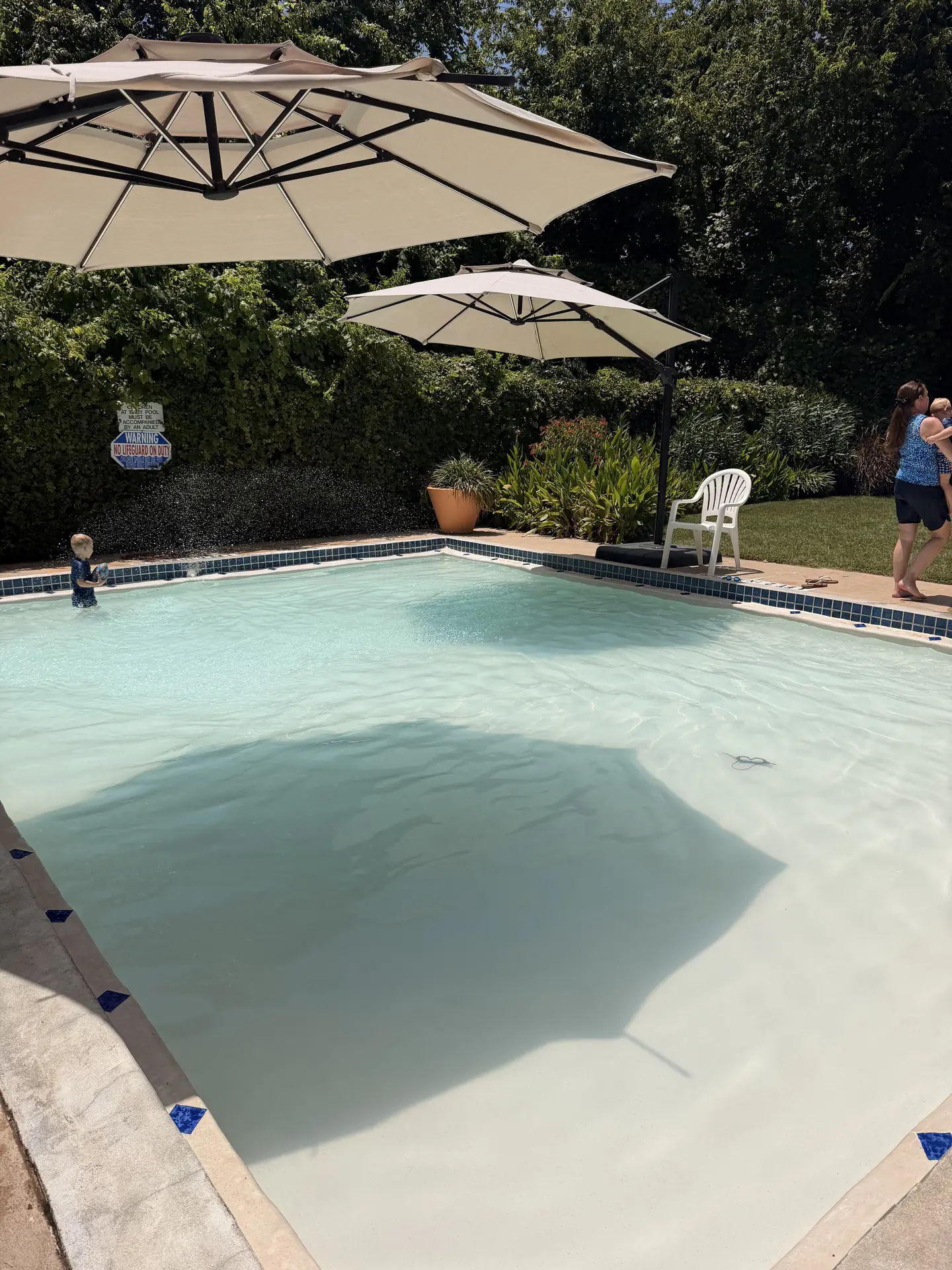 Kiddie pool with shade umbrellas at Heights Pool