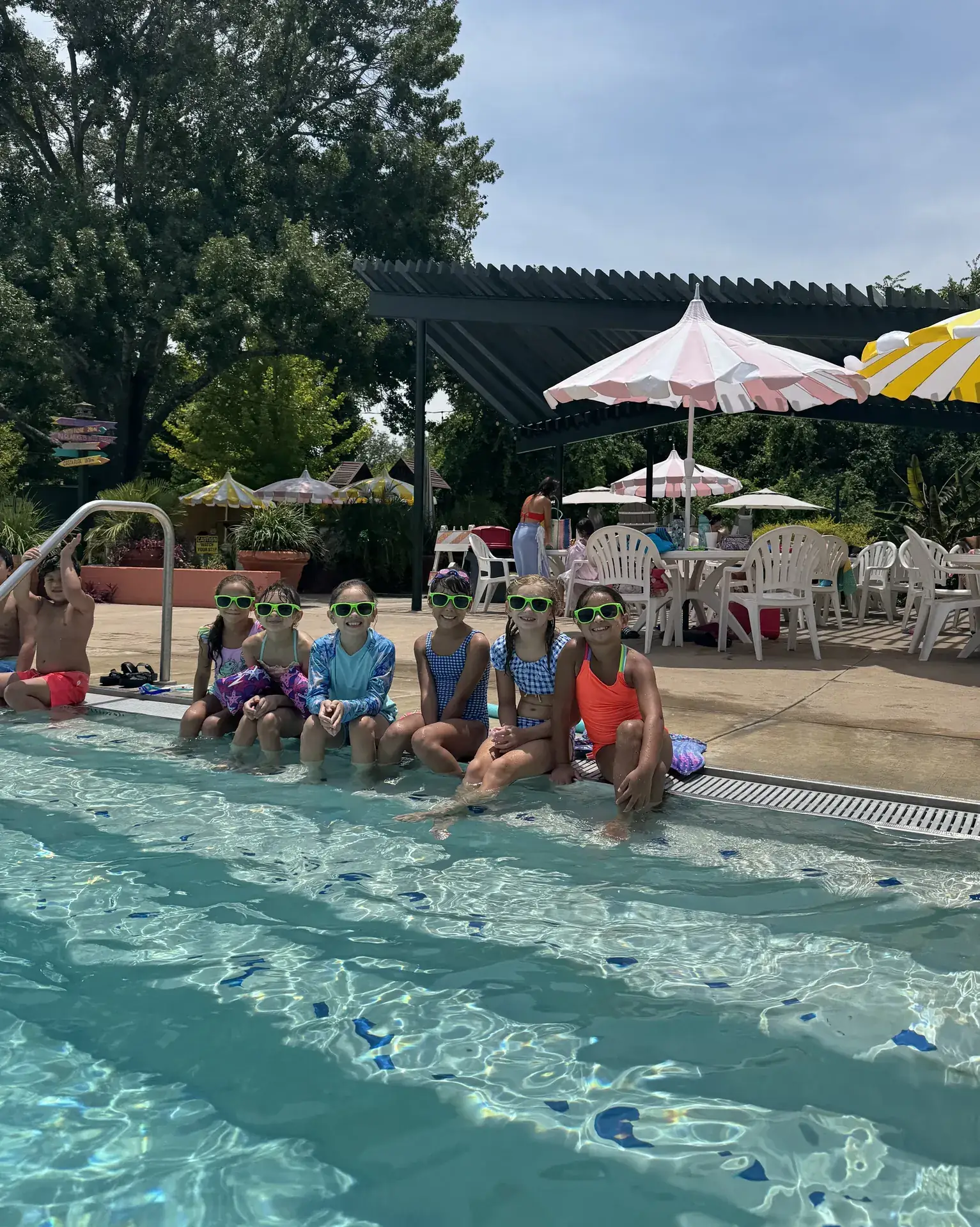 Kids at the pool edge during a Heights Pool summer day