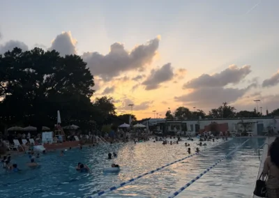 Members enjoying a sunset swim event at Heights Pool, San Antonio